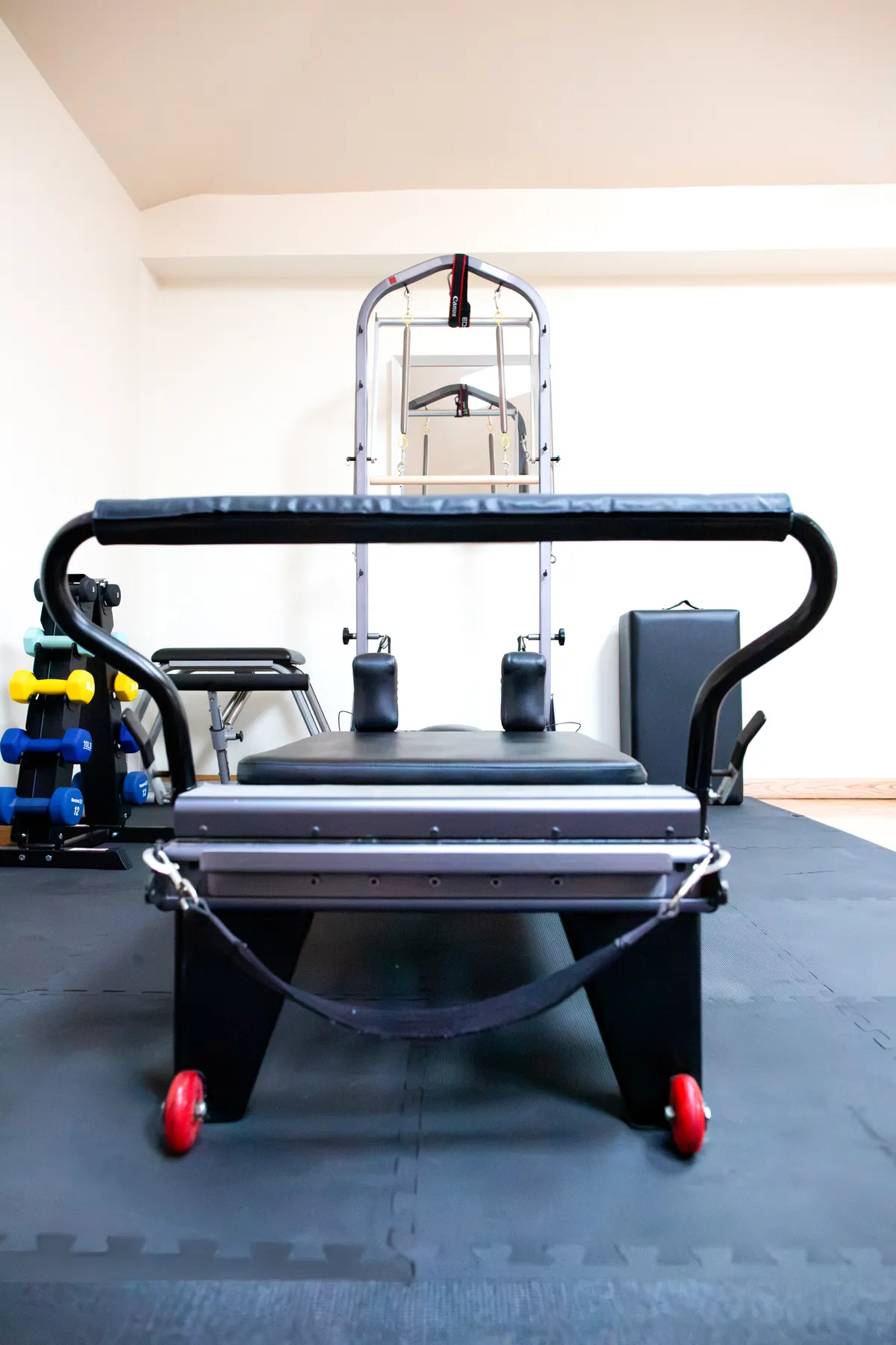 A Pilates reformer and tower inside the Sculpt & Stretch studio